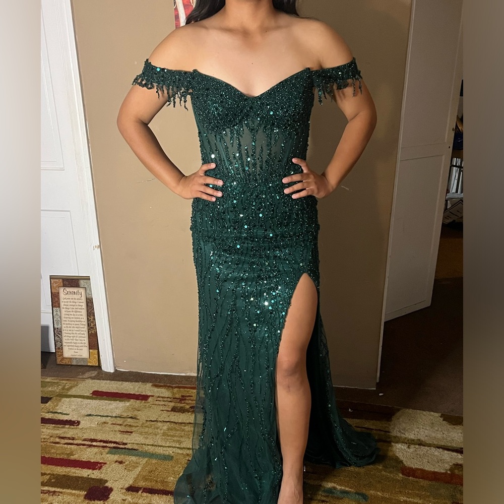 Woman’s formal dress only used once. Beaded, boning in midsection.